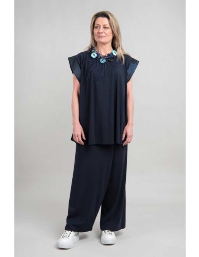 Igor-grey-tunic-and-wide-pants-with-necklace